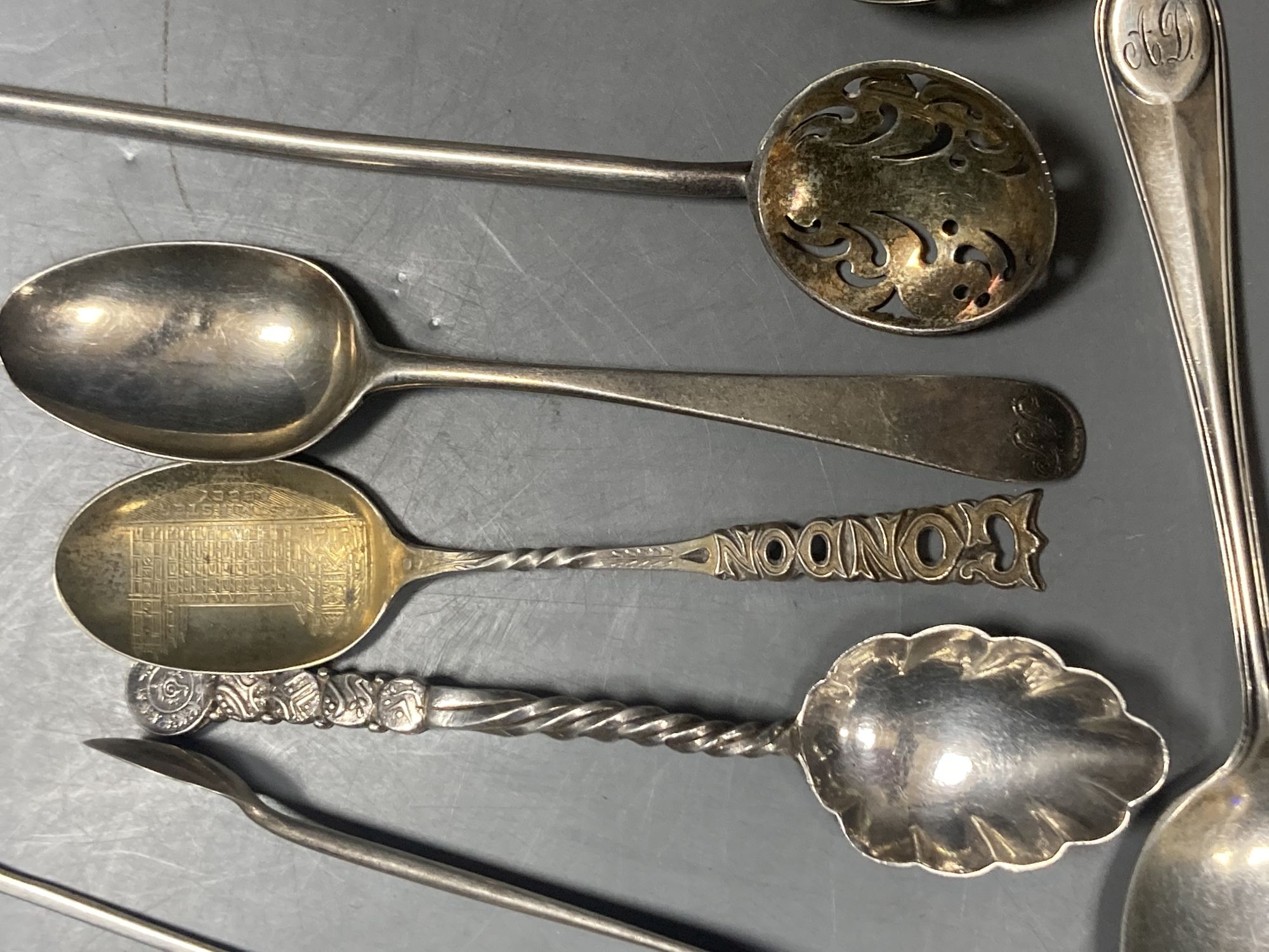 A group of assorted Chinese white metal spoons and forks, including set of six teaspoons and ten small items of English silver.